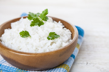 Boiled rice in a wooden bowl