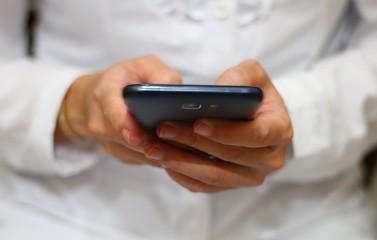 women holding smartphone in close up