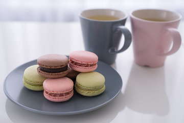 Macaroon and Coffee or tea on white table