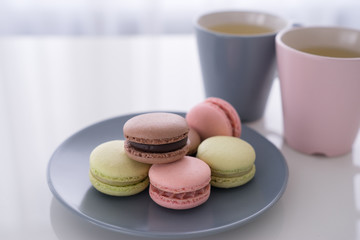 Macaroon and Coffee or tea on white table