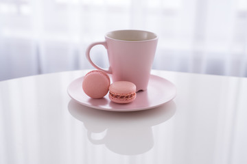Macaroon and Coffee or tea on white table