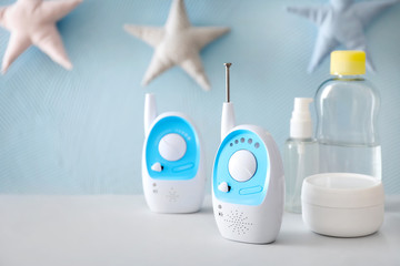 Baby monitors and different cosmetics on table