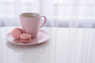 Macaroon and Coffee or tea on white table