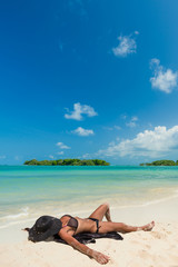 Fototapeta na wymiar woman resting at the tropical beach