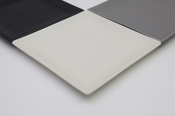 Black, white and gray square plates for sushi