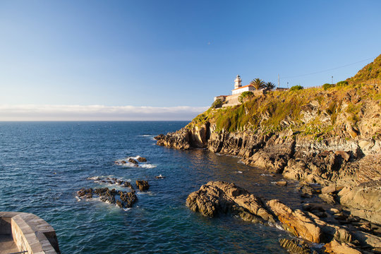 Lighthouse on the coast in Cudillero, Spain