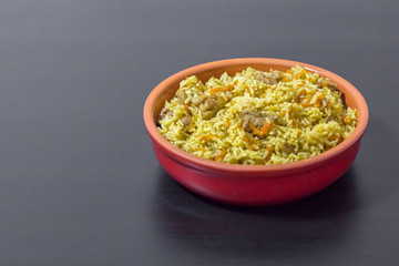 Pilaf with beef, carrots, onions, garlic, pepper and cumin. A traditional dish of Asian cuisine.
