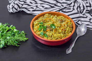 Pilaf with beef, carrots, onions, garlic, pepper and cumin. A traditional dish of Asian cuisine.