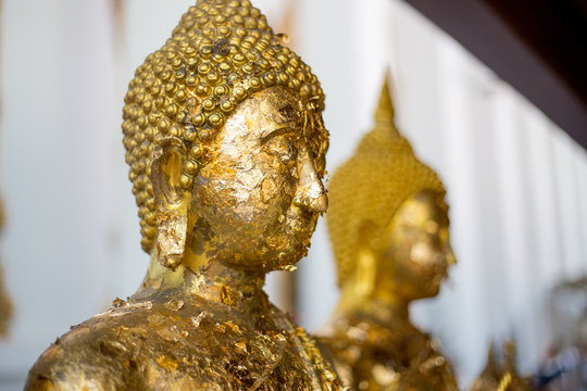 Tradditional Thai face of Buddha for Buddhism at Temple in Thailand. Golden Buddha is believed and faith of Religious