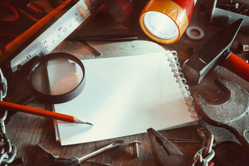 Workbench with notebook and pencil