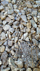 Metal grid laying and stone on construction area