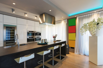 Modern kitchen with island and stools