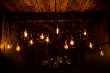 Vintage tungsten lamps in stylish loft interior