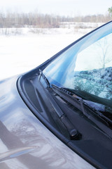 in a beautiful sunny day beige car parked at the side of the highway
