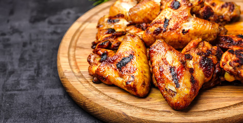 Grilled or oven roasted chicken wings glazed with barbecue sauce