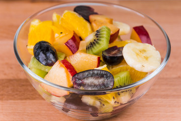 Beautiful delicious fresh Vegetarian fruit salad in a glass cup - a healthy low-calorie food
