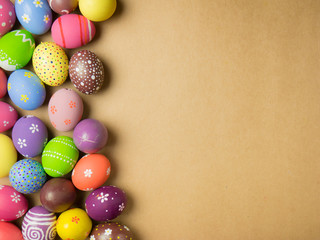 Fototapeta na wymiar Easter eggs on the brown background.