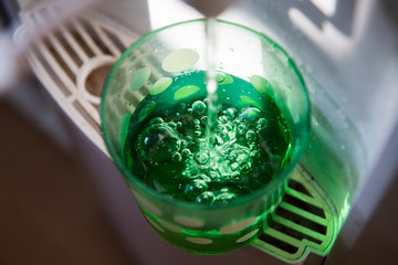 A glass of pure fresh water is poured into a glass