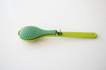 Large plastic spoons on white background