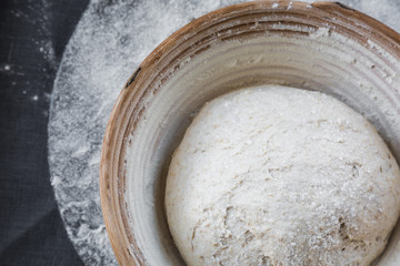 Dough on natural rye ferment. With bran. Alive. Natural. Without yeast. The concept of a healthy diet. In a rattan basket