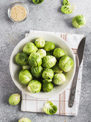 Brussels sprouts cabbage fresh organic in jar on table in kitchen