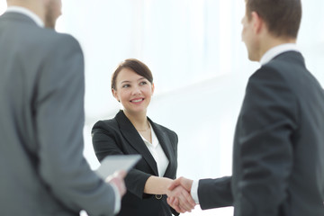 Negotiating business,Image business woman handshake