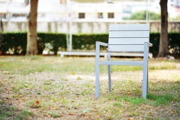 White chair on grass.