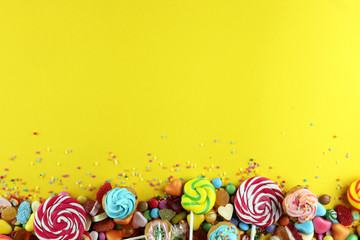 candies with jelly and sugar. colorful array of different childs sweets and treats.