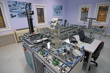 Industry 4.0 concept. controling smart factory line which is equipped with sensors and robotic arm. industrial automation line.