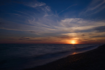 Fototapeta na wymiar Summer sunset above the sea