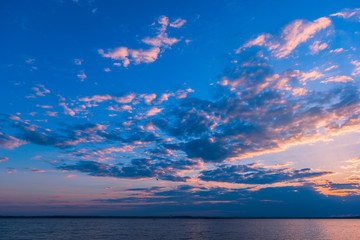 Fototapeta na wymiar Summer sunset over lake or sea