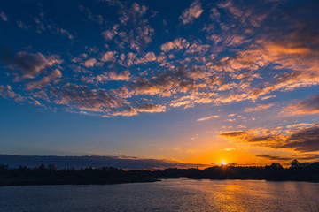 Natural sunset or sunrise over lake