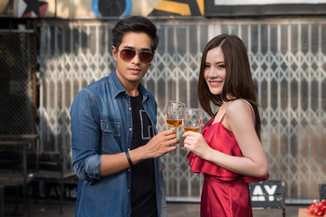 Young people asian clinking glasses. celebration, friends party and holidays concept.