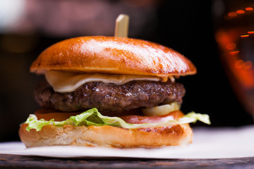 Tasty grilled prawn and beef burger with lettuce