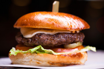 Tasty grilled prawn and beef burger with lettuce