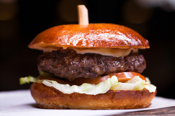 Tasty grilled prawn and beef burger with lettuce