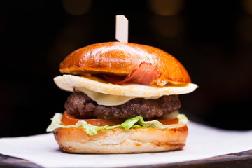 Tasty grilled prawn and beef burger with lettuce
