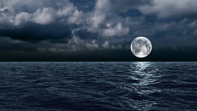 The moon over the sea in the clouds
