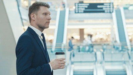 Young businessman with coffee