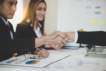 Asian Businessmen handshaking after successful business meeting. goals, business deals concept