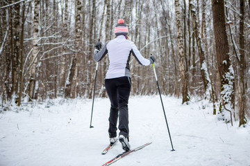 Photo of female skier in white jacket