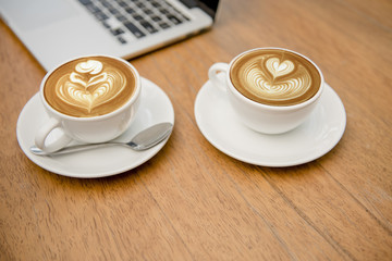 Closeup two cup of coffee latte art