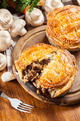 Fresh beef stew pie on a cutting board