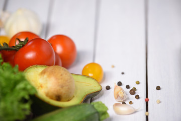 Set of different fresh vegetables on white wooden table, selective focus product top view and copy space.