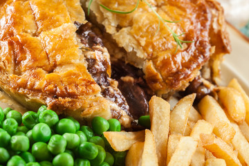 Homemade beef stew pie with french fries