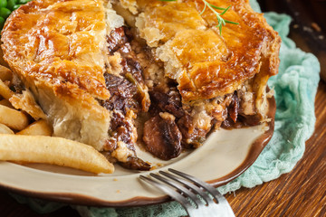 Homemade beef stew pie with french fries