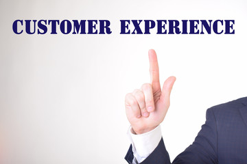 A businessman shows an inscription:CUSTOMER EXPERIENCE