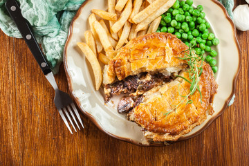Homemade beef stew pie with french fries