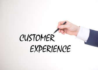 The businessman writes a black marker inscription:CUSTOMER EXPERIENCE