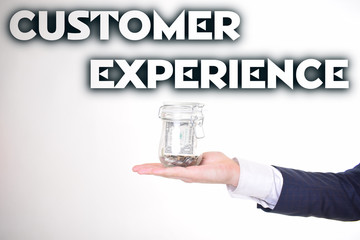 A businessman with a bank of money shows an inscription:CUSTOMER EXPERIENCE
